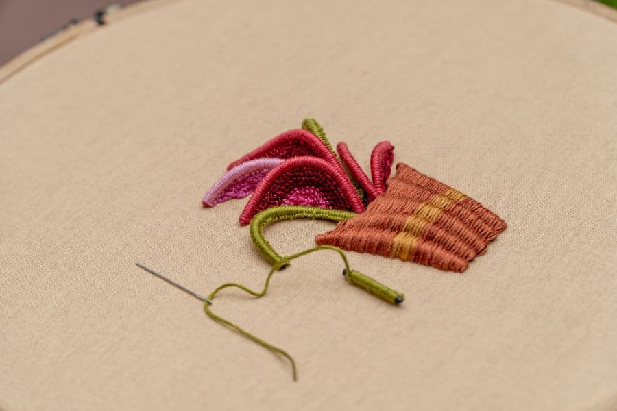 A close view of an embroidered design stitched into fabric