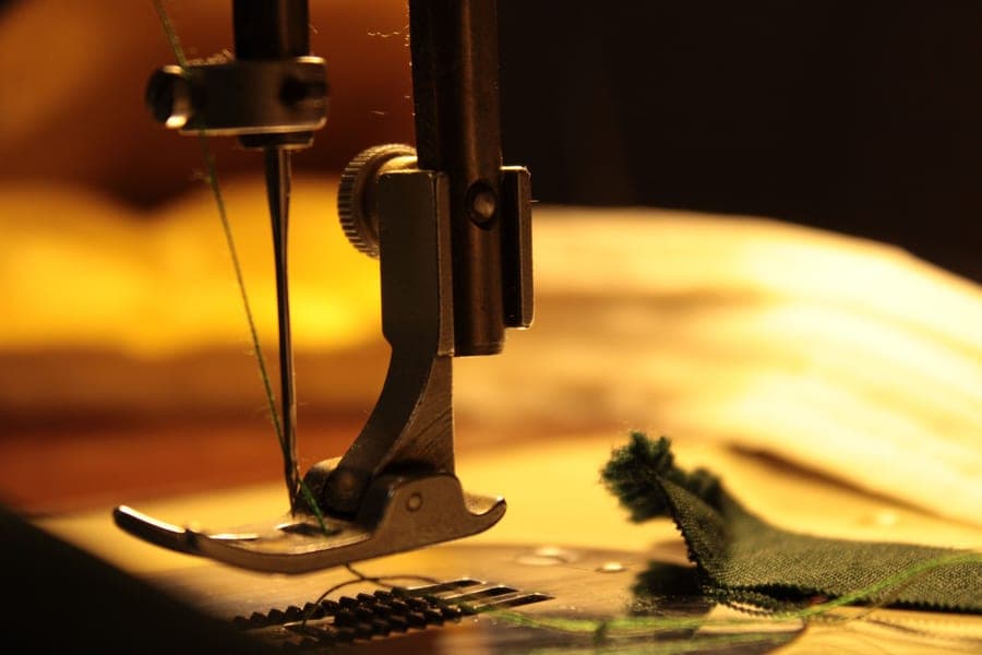 Close-up of a sewing machine needle and thread