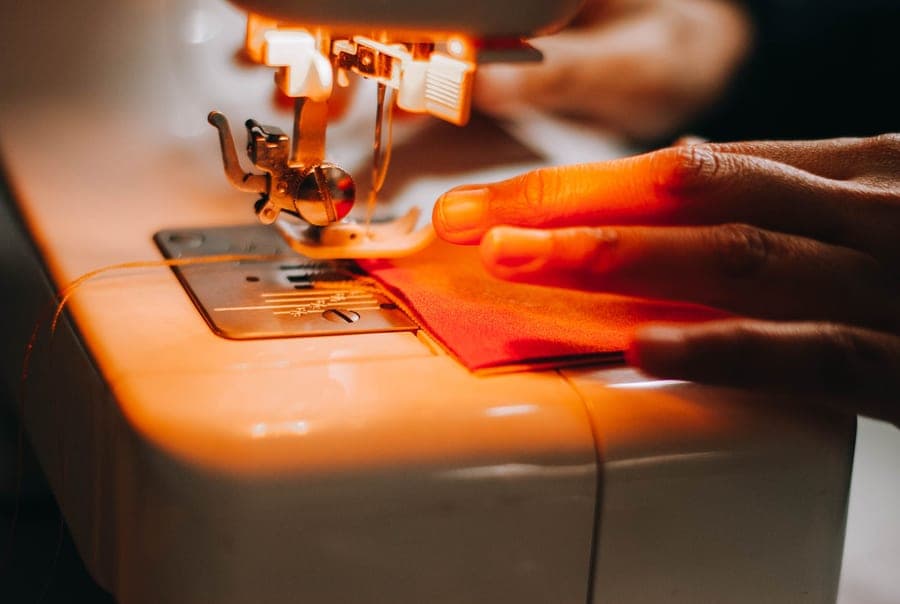 A beginner sewing machine with a length of fabric under the foot