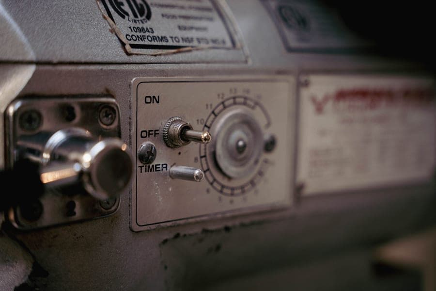 Close-up of the stitch selector dials on a mechanical sewing machine